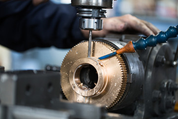 Metallurgy heavy industry. Factory for production industrial machines. Low light close up shot. Short depth of field.