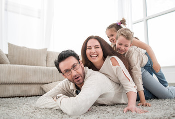 happy family relaxing in comfortable living room
