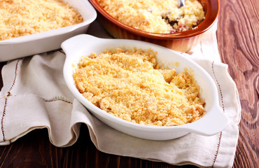 Apple and cinnamon crumble cake in baking tin