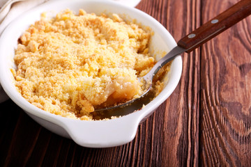 Apple and cinnamon crumble cake in baking tin