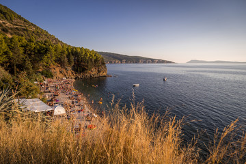 Beach music party festival in summer coast Croatia island water psy people fun 