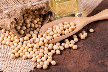 Soybean oil on a wooden background. rustic style