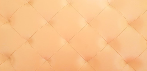 Fototapeta na wymiar Leather. Brown luxury decoration sofa texture background.
