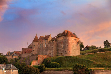 Beautiful view of Ch?teau de Dieppe at sunset in Normandy, France, with a vibrant sunset sky - obrazy, fototapety, plakaty