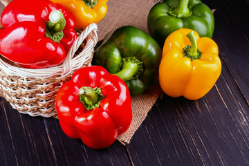 Three sweet peppers on a wooden background, Cooking vegetable salad