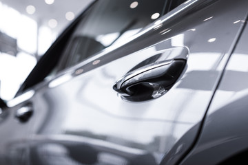 Obraz na płótnie Canvas close up view of luxury shiny car in auto salon