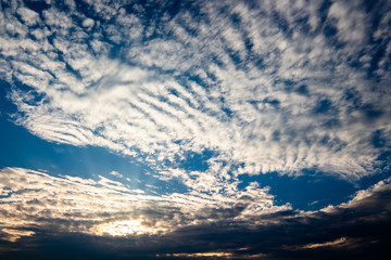 colorful dramatic sky with cloud at sunset.