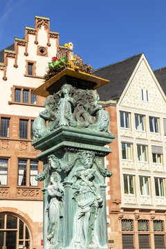 old fountain at roemer with an artifical stoch nest and allegory figures