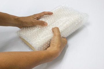hand man hold bubble wrap, for Packing and protection product cracked or insurance During transit. 