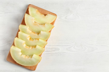 slices of melon on white table