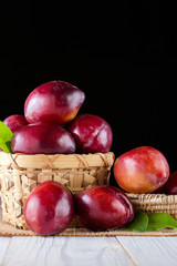 Sweet plums on wooden background