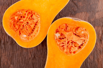 butternut squash over old wood background