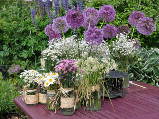 Collection of pretty purple and white flowers ready for display.
