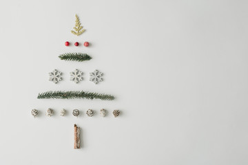 Christmas tree made of various natural winter things. Minimal New Year concept. Flat lay.