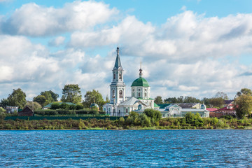 Naklejka premium St. Catherine's convent. Russia, the city Tver. View of the monastery from the Volga river. Picturesque clouds in the sky. Summer or autumn day.