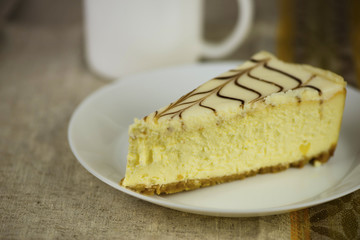 curd cake with cream on a plate