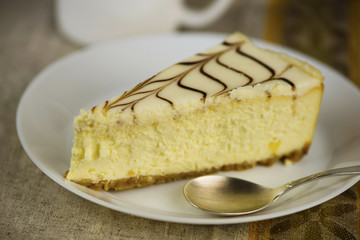 curd cake with cream on a plate