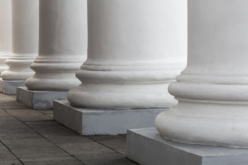 White stone columns of the old building. The facade of the theater.