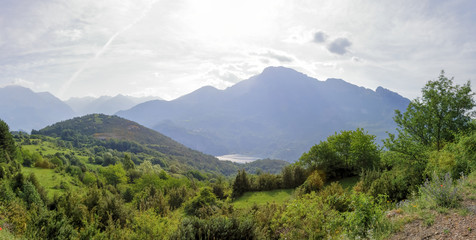 A Bubal lake landscape seen from the path to the Piedrafita de Jaca lake in the Aragonese Pyrenees in a cloudy and sunny day