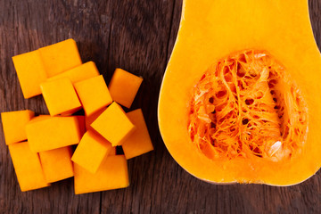 butternut squash over old wood background