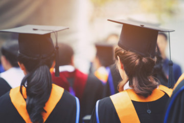 blurred image backside,the student graduation during commencement success graduates of the...