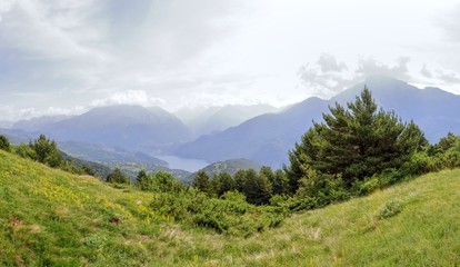 A Bubal lake landscape seen from the path to the Piedrafita de Jaca lake in the Aragonese Pyrenees in a cloudy and sunny day