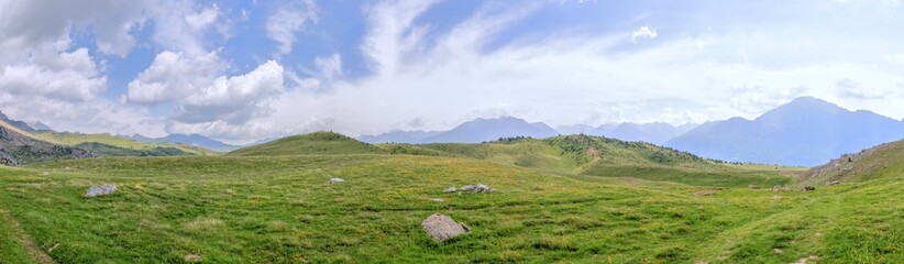 The mountains and the massif along the green path to the Piedrafita de Jaca lake in the aragonese Pyrenees mountains