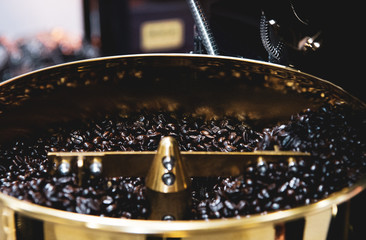 Machine for roasting coffee close up, Roasted coffee in coffee roaster
