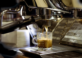 espresso shot from coffee machine in coffee shop,Coffee maker in coffee shop