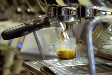 espresso shot from coffee machine in coffee shop,Coffee maker in coffee shop