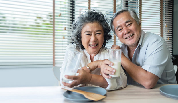 Asian Senior Couple drinking milk together.