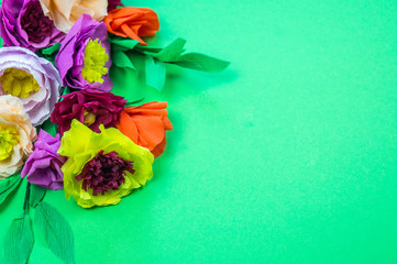 tools making crepe paper flowers green background