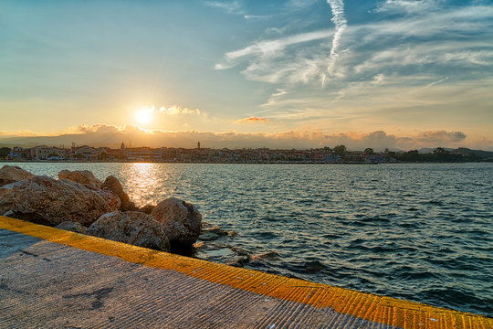 the harbor of Lixouri Kefalonia with ocean and sunset