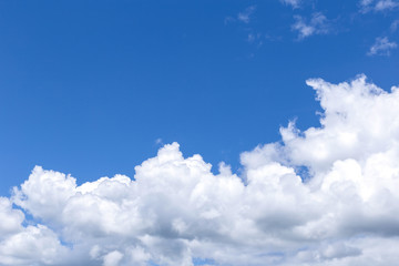 Naklejka na ściany i meble Blue sky background with white clouds, rain clouds on sunny summer or spring day.