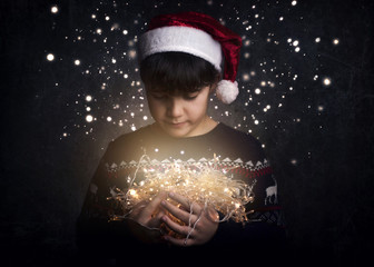 Merry Christmas, child with Christmas lights