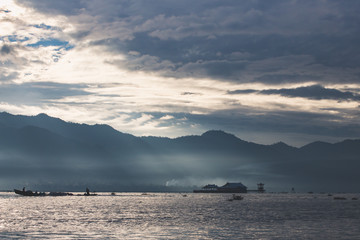 transparent light passes through the morning fog and clouds over lake Inle, burma, myanmar