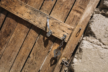 Old wooden door and heart shaped lock