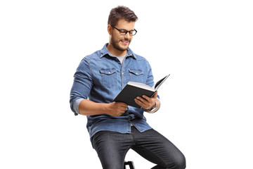 Young guy reading a book