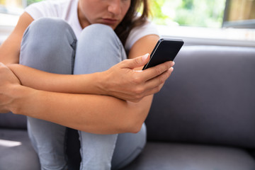 Obraz premium Young Woman Using Smartphone