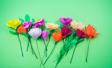 tools making crepe paper flowers green background
