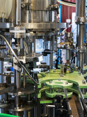 Conveyor for bottling and packing bottles in the factory.