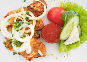 Delicious grilled shashlik with adjika and vegetables. Top view.