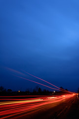 Headlights of cars, taken with long-term exposure to the background of the sky