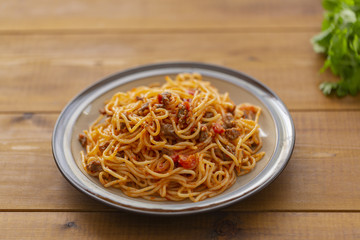 Spaghetti bolognese pasta with tomato sauce and minced meat. Homemade healthy italian pasta on wooden background
