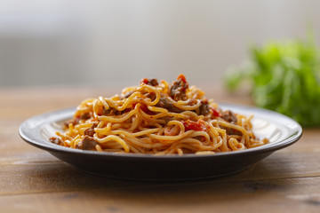 Spaghetti bolognese pasta with tomato sauce and minced meat. Homemade healthy italian pasta on wooden background