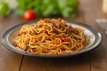 Spaghetti bolognese pasta with tomato sauce and minced meat. Homemade healthy italian pasta on wooden background