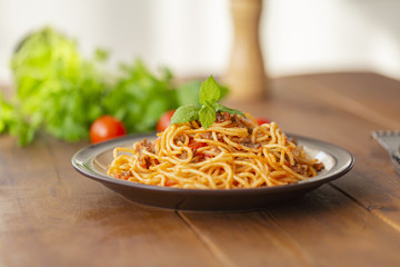 Spaghetti bolognese pasta with tomato sauce and minced meat. Homemade healthy italian pasta on wooden background