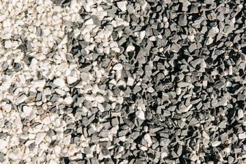 top view of black and white pebble stones for background