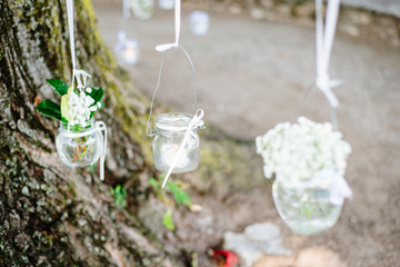 oak with ribbons and jars with candles decoration lanterns