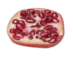 Fresh pomegranate cut on a white background